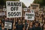 Protesters holding signs with messages like 'Hands Off' during a demonstration"