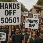 Protesters holding signs with messages like 'Hands Off' during a demonstration"