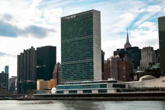 "United Nations Headquarters building in New York City overlooking the East River"