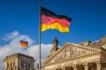 German flag flying at the Reichstag building in Berlin, Germany.