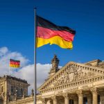 German flag flying at the Reichstag building in Berlin, Germany.