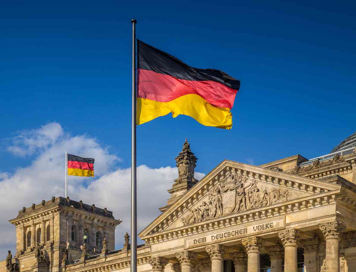 German flag flying at the Reichstag building in Berlin, Germany.