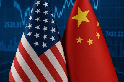 U.S. and China national flags side by side with a financial chart in the background symbolizing trade tensions.