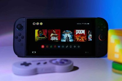 Nintendo Switch console with popular games on screen, accompanied by a retro controller and a Mario-themed cube under colorful lighting.