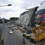 Traffic and Orion Mall with IMAX theater in Bangalore, India.