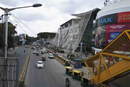 Traffic and Orion Mall with IMAX theater in Bangalore, India.