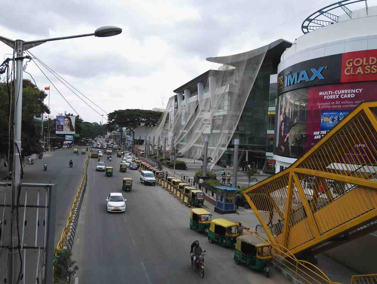 Traffic and Orion Mall with IMAX theater in Bangalore, India.