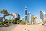 Museum of the Future building in Dubai with skyscrapers in the background.