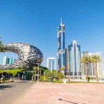 Museum of the Future building in Dubai with skyscrapers in the background.