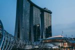 Marina Bay Sands and Helix Bridge illuminated at dusk in Singapore
