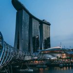 Marina Bay Sands and Helix Bridge illuminated at dusk in Singapore